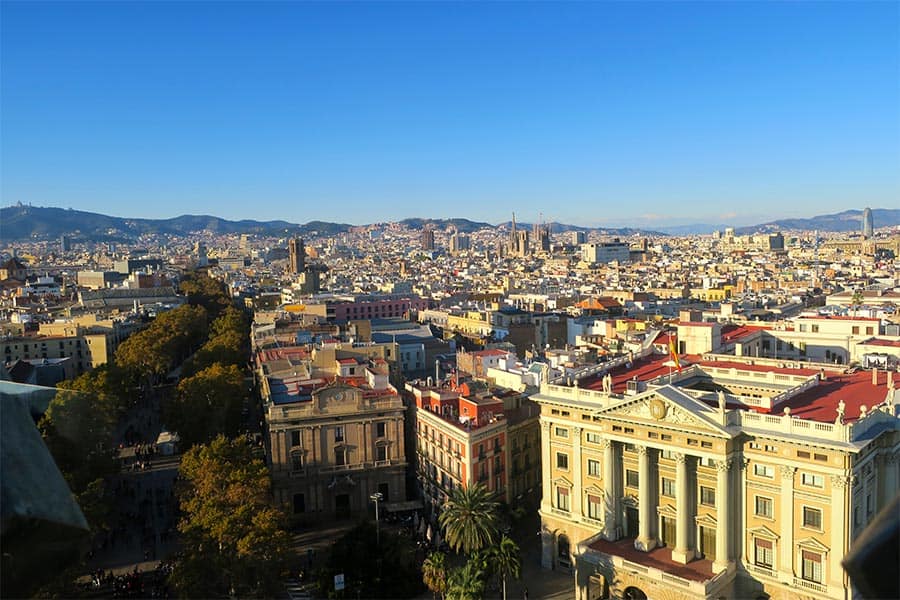 Aerial view of a city from above on a sunny day.